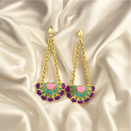Gold chain earrings with colorful geometric designs on a satin background. Purple Variant.