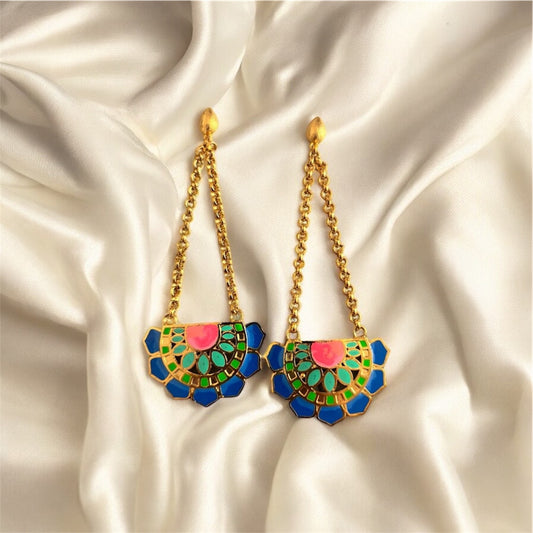 Colorful earrings with gold chains on a satin background. Blue Variant