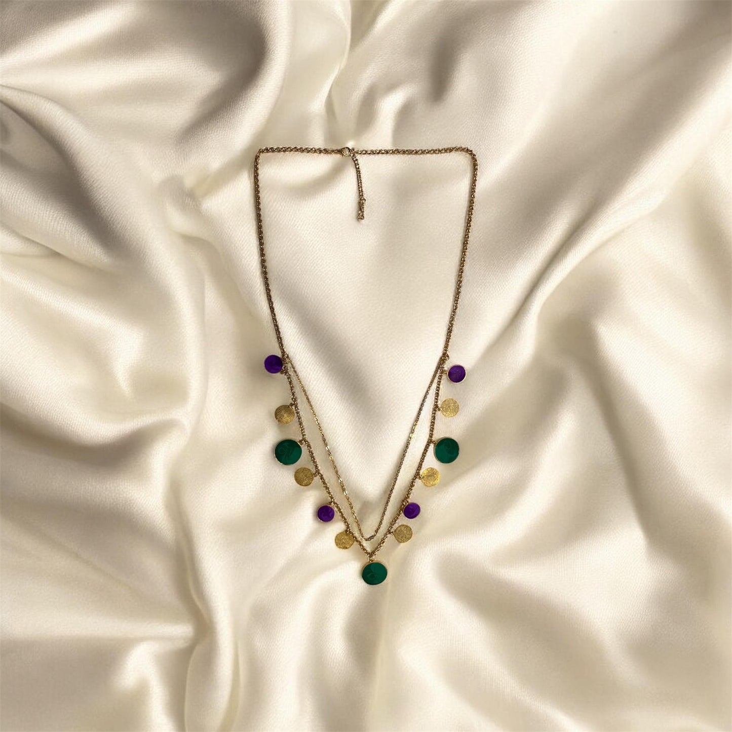 Necklace with colorful beads on a satin surface